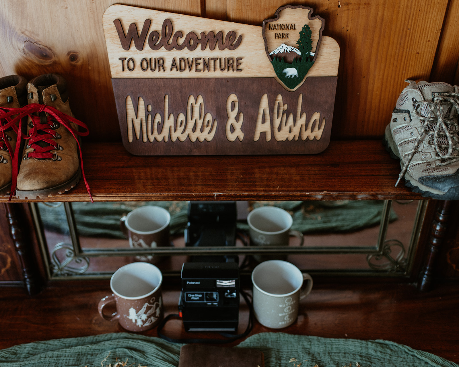 Detail photo of hiking books and couple's name on sign for New Hampshire Elopement