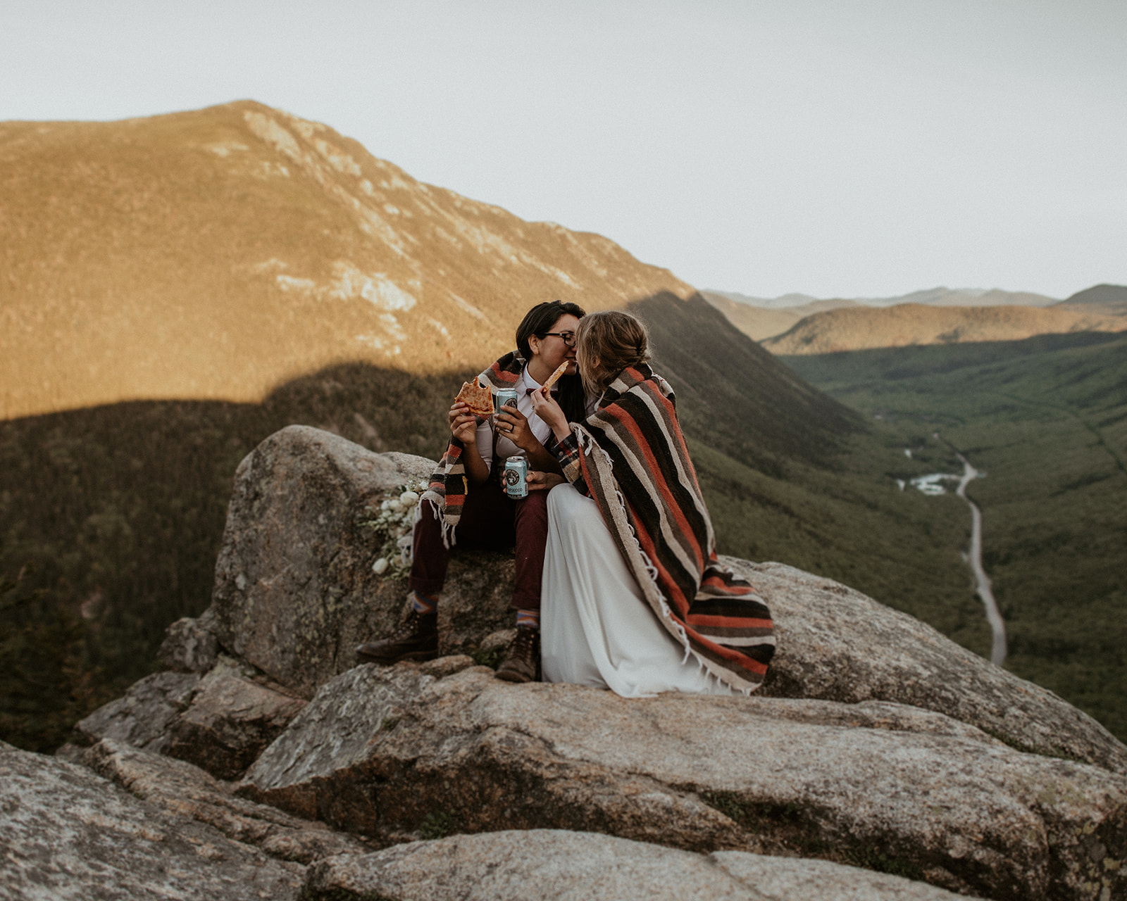 Couple snuggles together for White Mountains Elopement