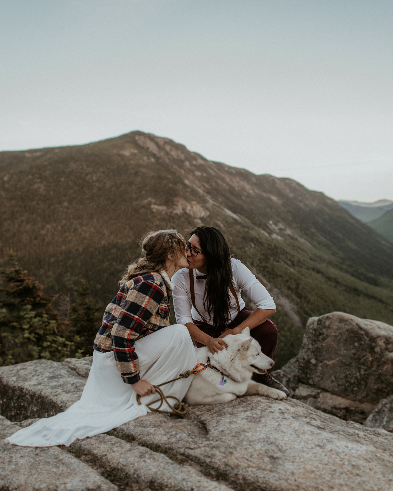 Couple poses with their dog during White Mountains Elopement