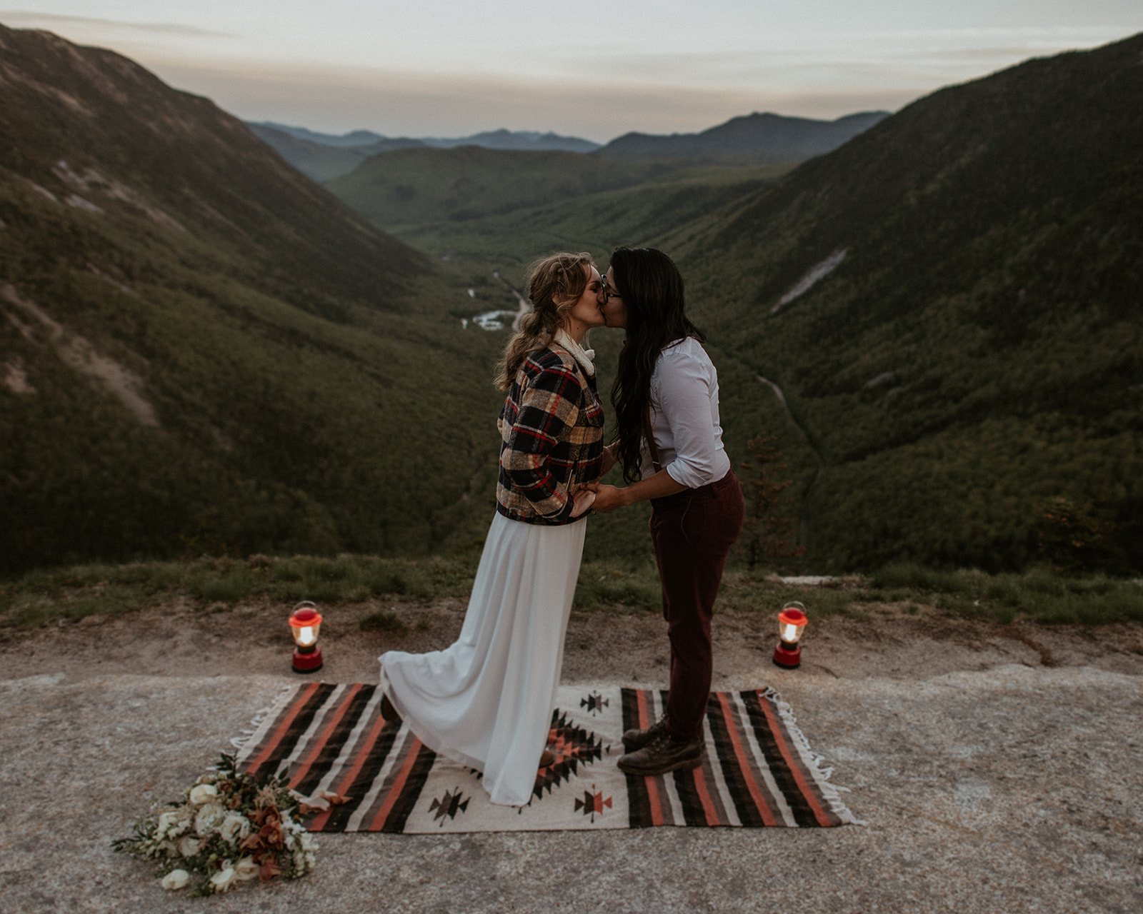 Brides kiss during elopement ceremony