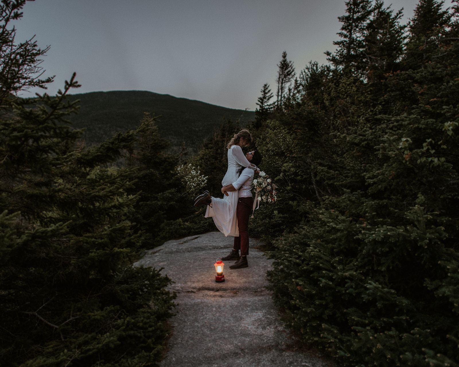 Couple poses during elopement portraits at Crawford Notch