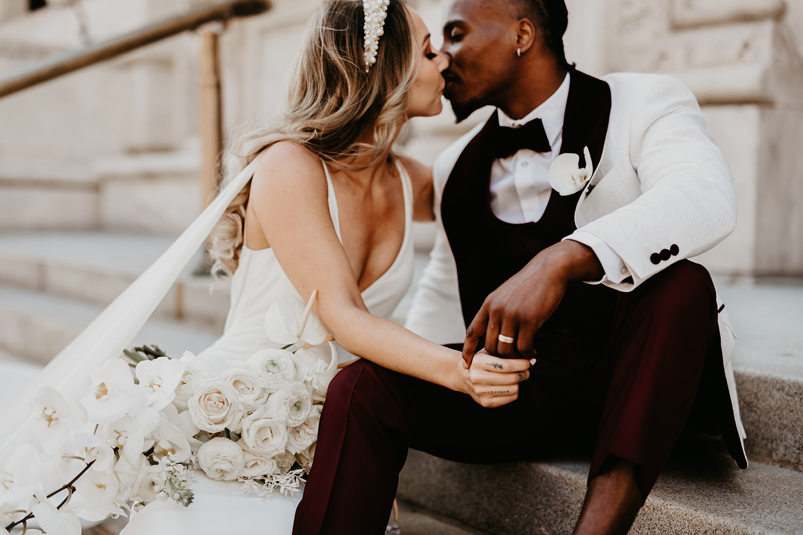 Chic and fashionable wedding portrait in downtown Cleveland - showcasing the couple's impeccable style.