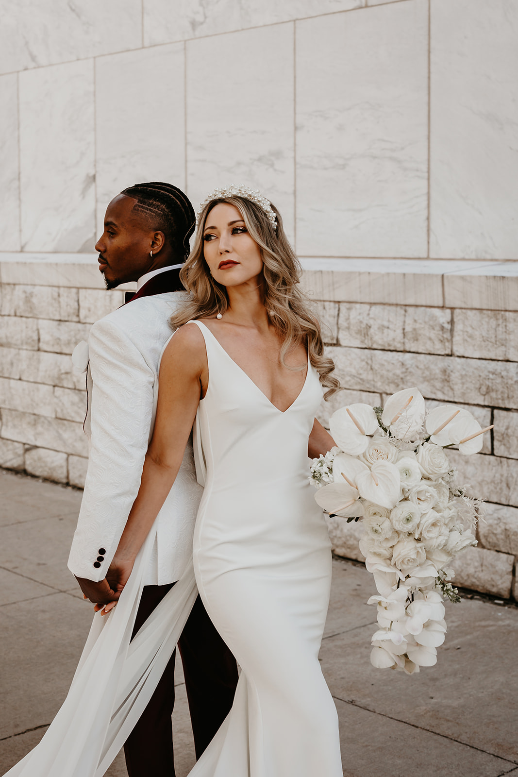 Trendy and sophisticated wedding portrait in downtown Cleveland - showcasing the couple's unique personality.