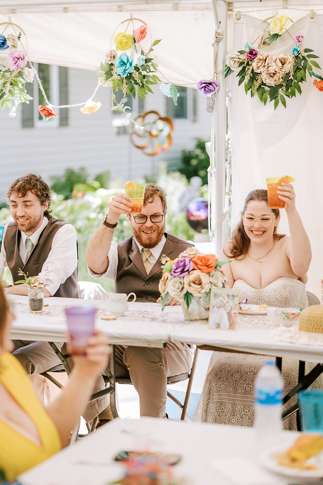couple celebrate their wedding during their reception in an intimate backyard wedding in central wisconsin