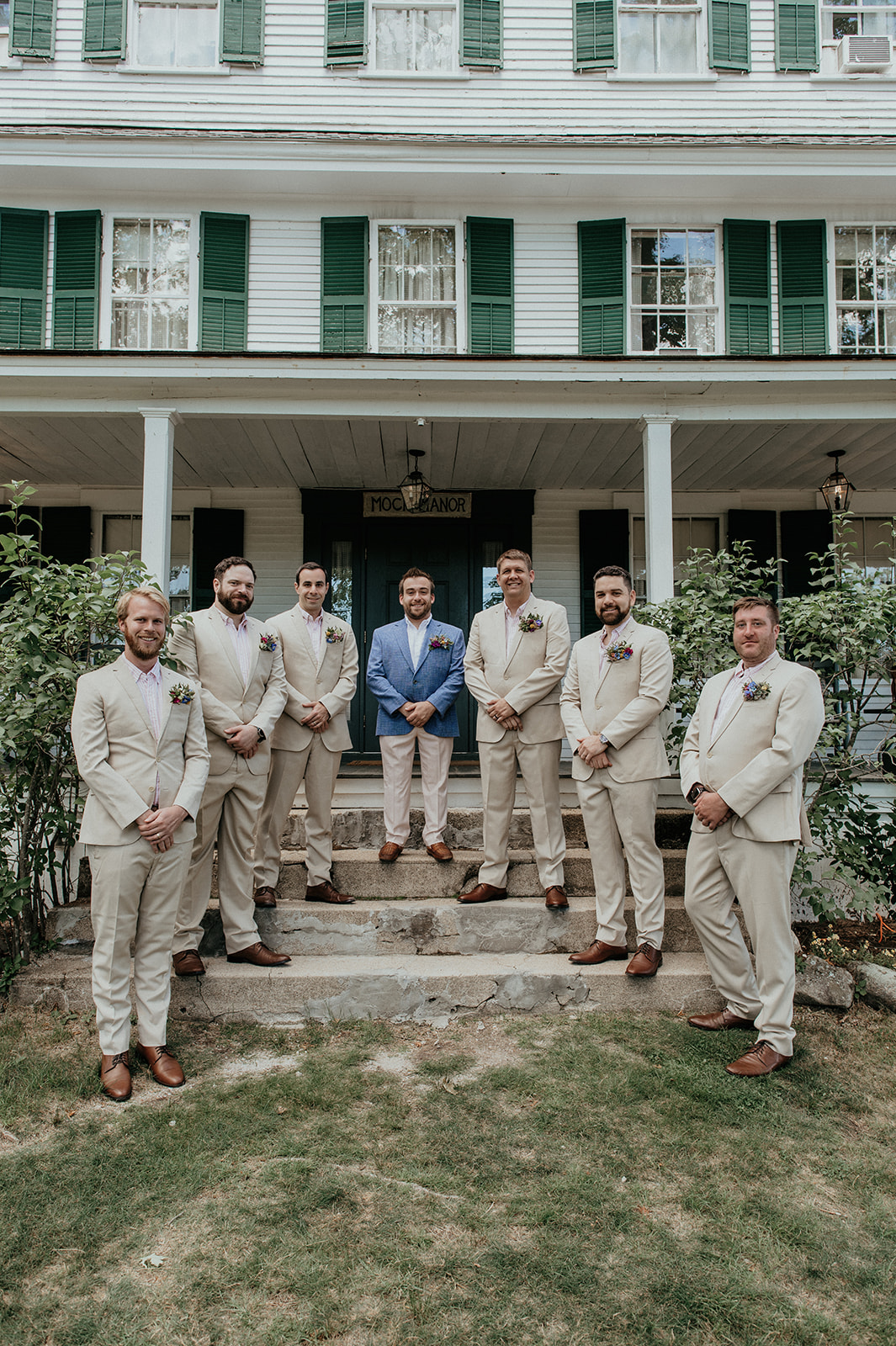 Groom with groomsmen on stairs of the main house at the Preserve at Chocorua