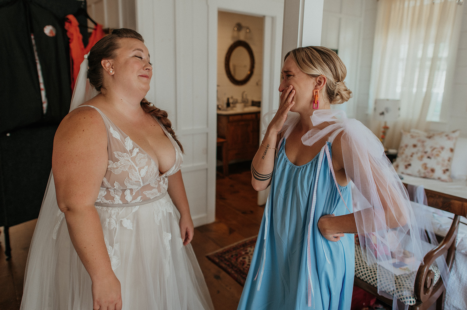 Bridesmaid cries with bride