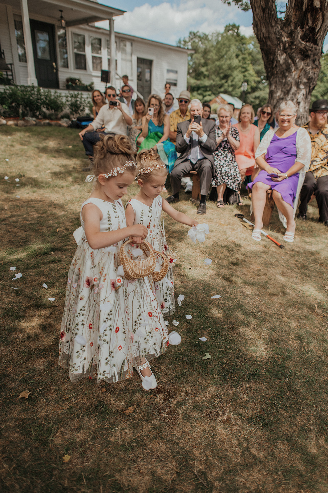 flower girls throwing petals down the aisle
