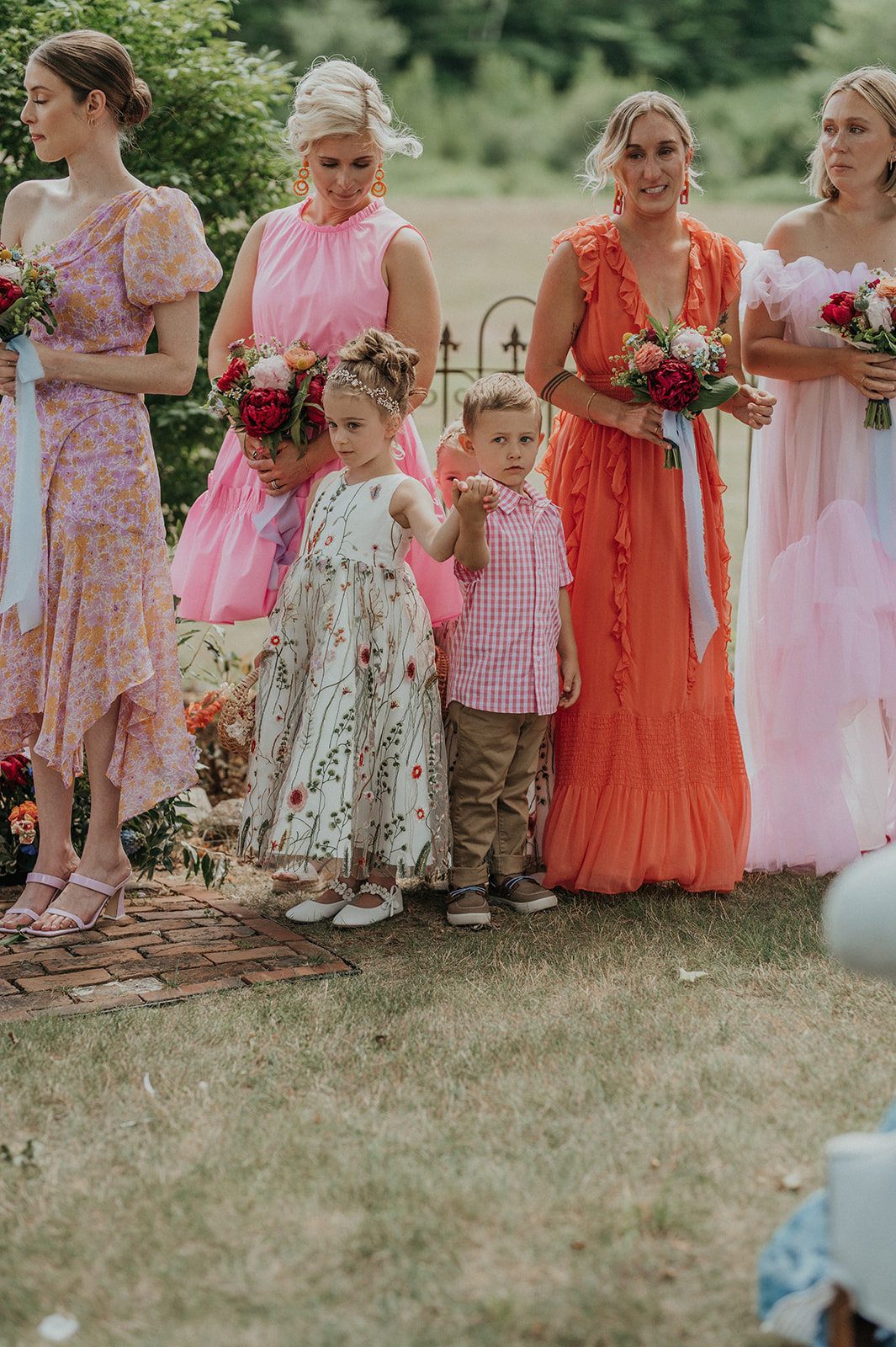 Candid photo of flower girl and ring bearer during ceremony