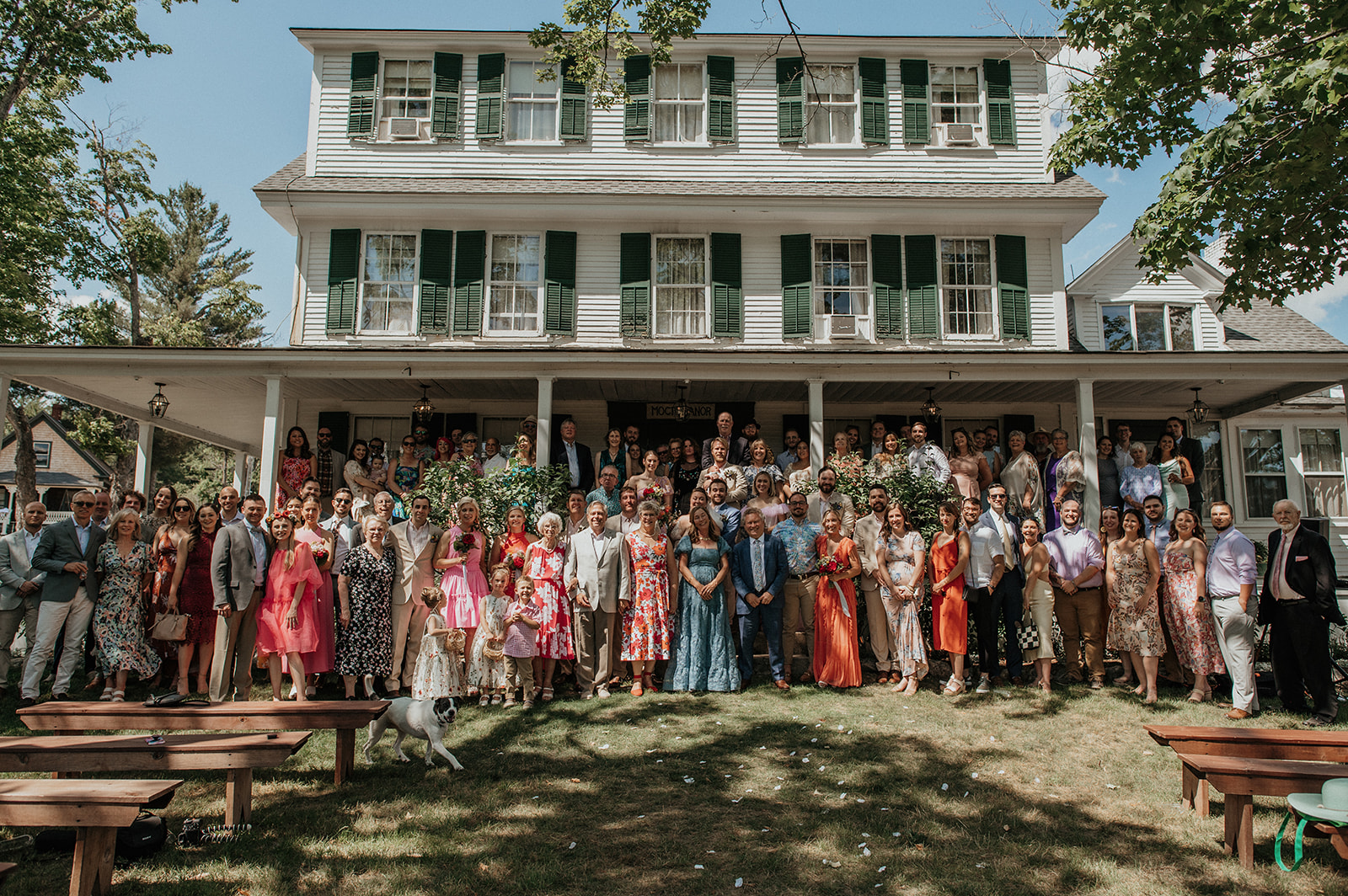 Large group photo of bride and groom with all guests on the steps of the main house at the preserve at chocorua wedding