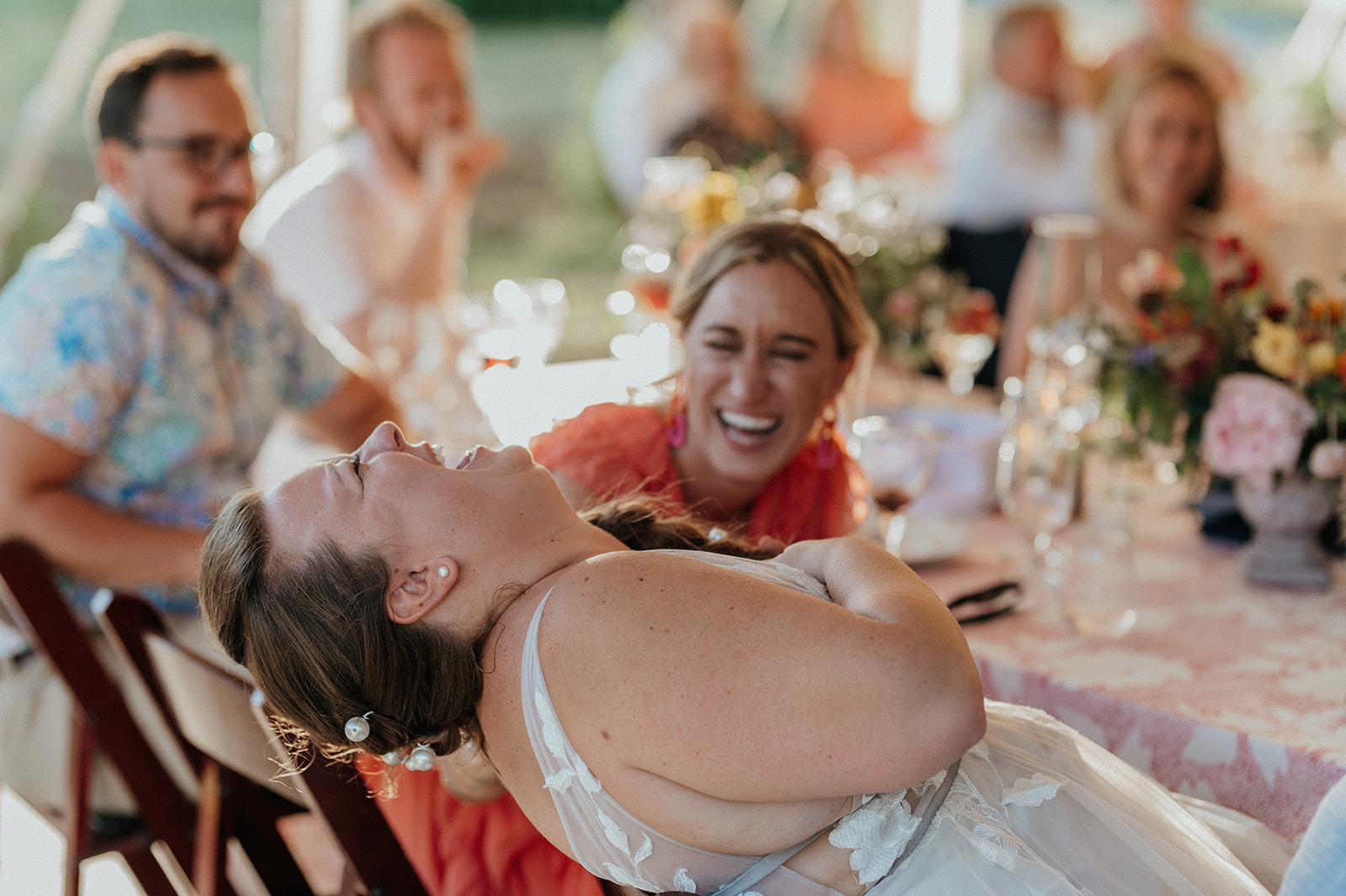 bride laughs during toasts