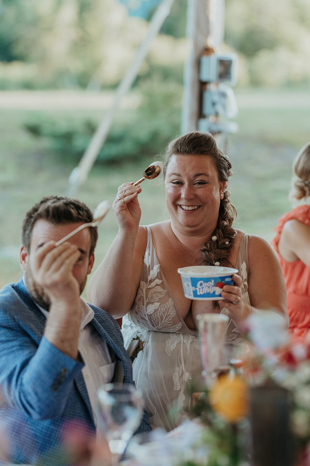 bride and groom eat cool whip during toasts