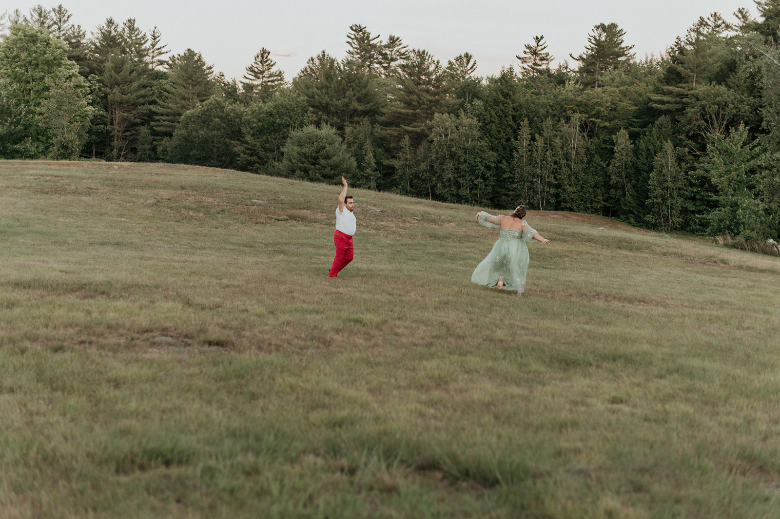 Bride and groom sunset portraits in colorful reception outfits at the preserve at chocorua