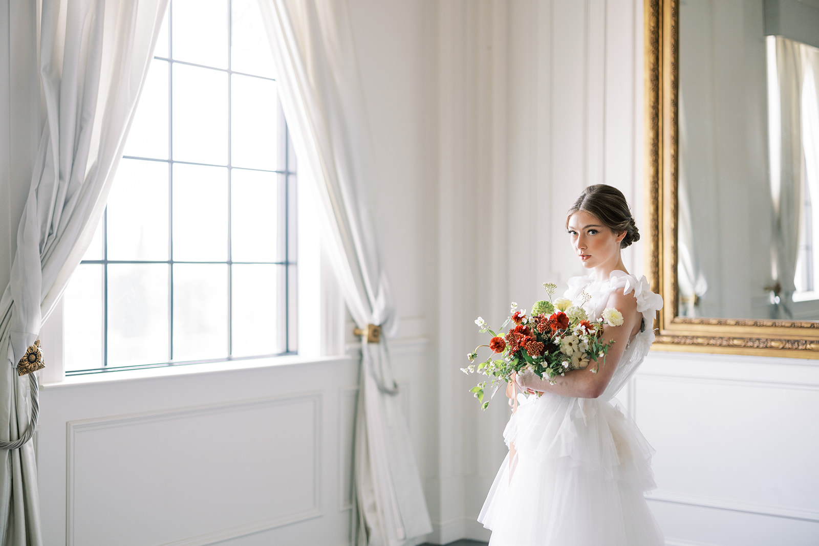 Beautiful bride holding flowers