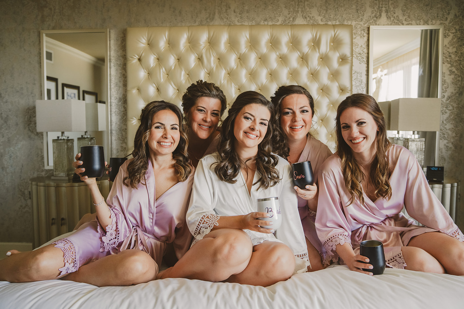 bridesmaids sharing some sparkling wine 