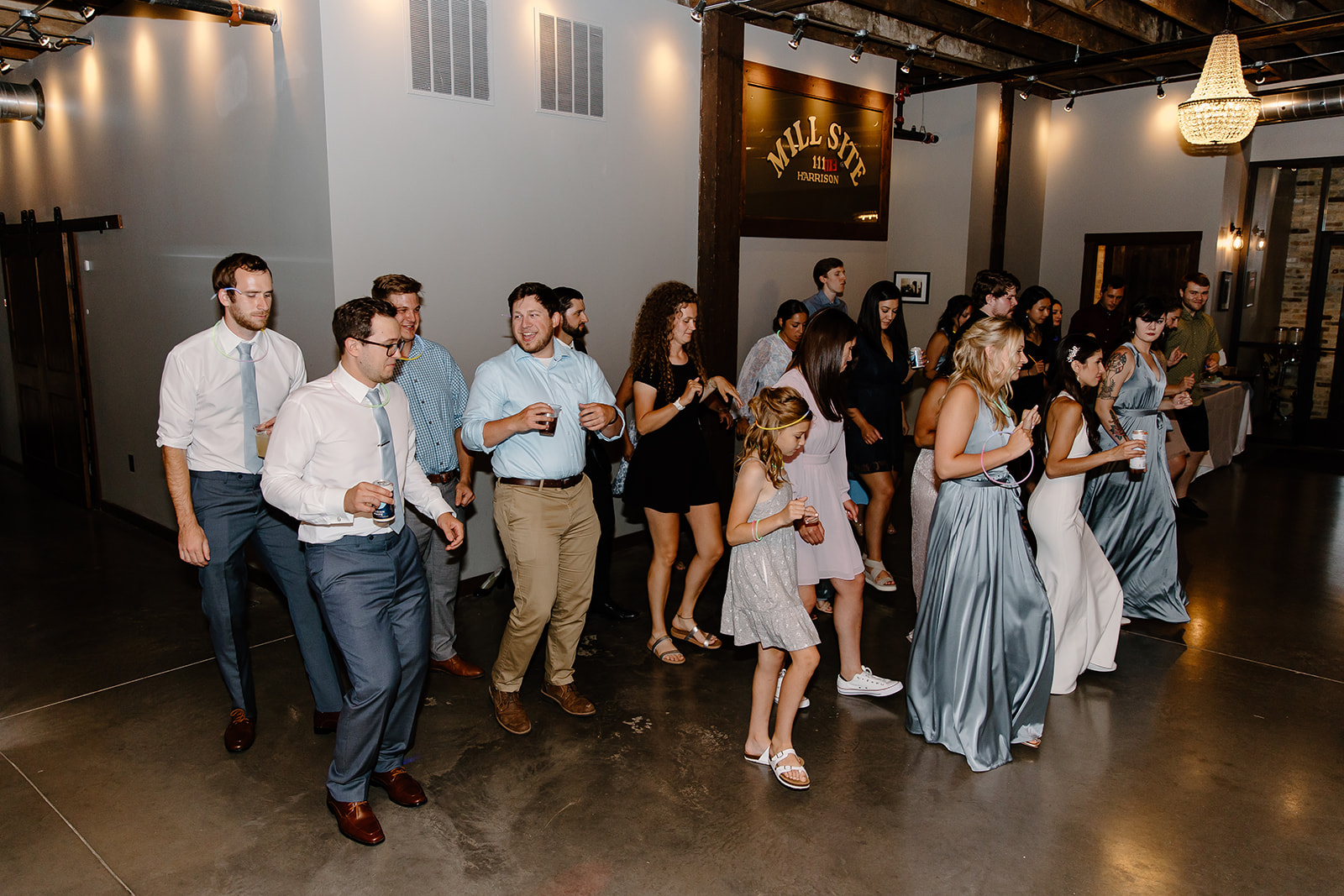 Guests dance with guests on the dance floor