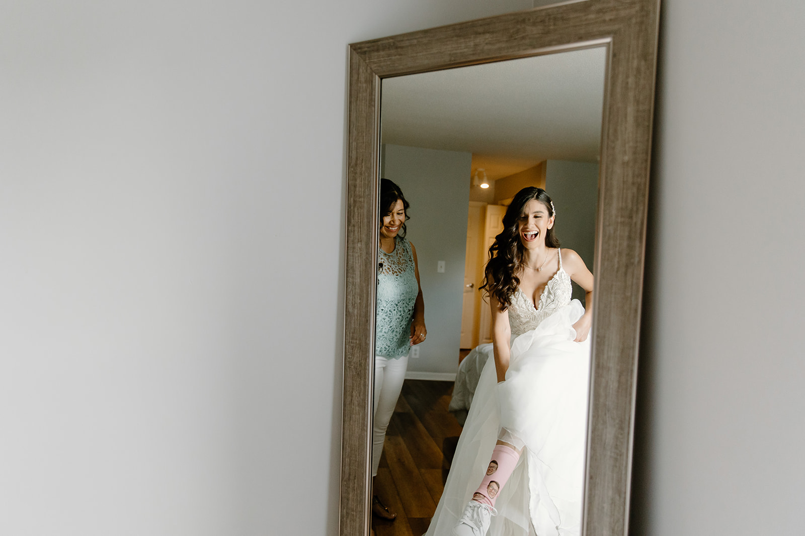Bride shows off her socks in a mirror