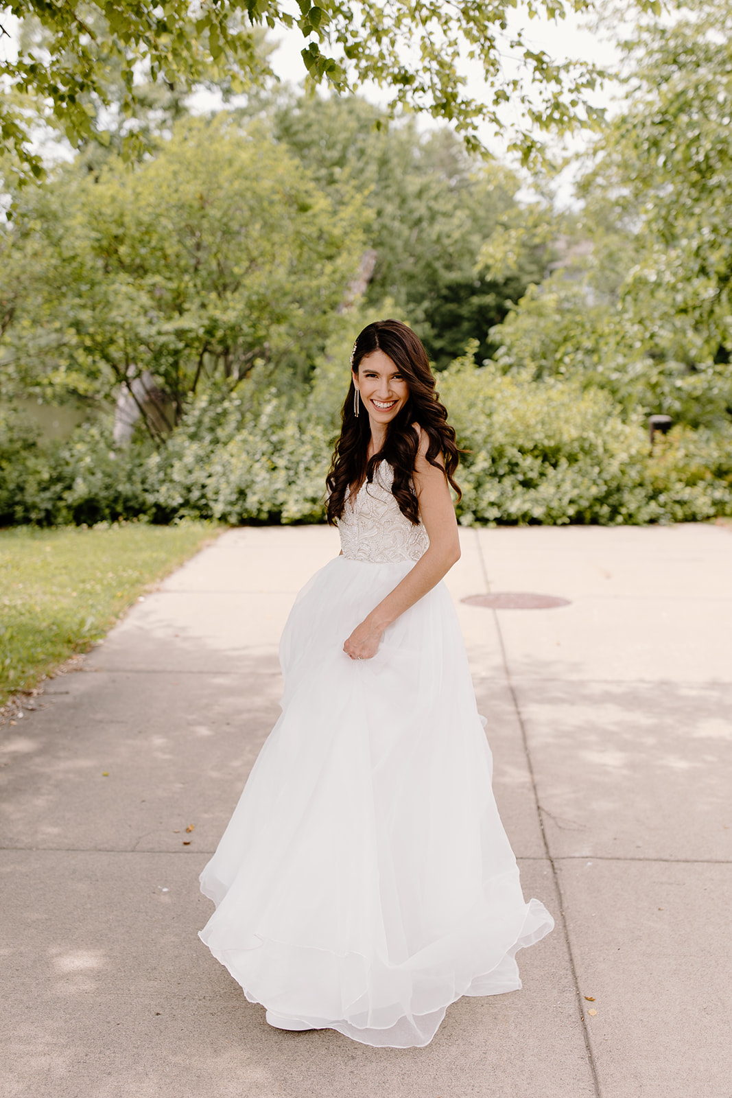 Bride twirls in her dress