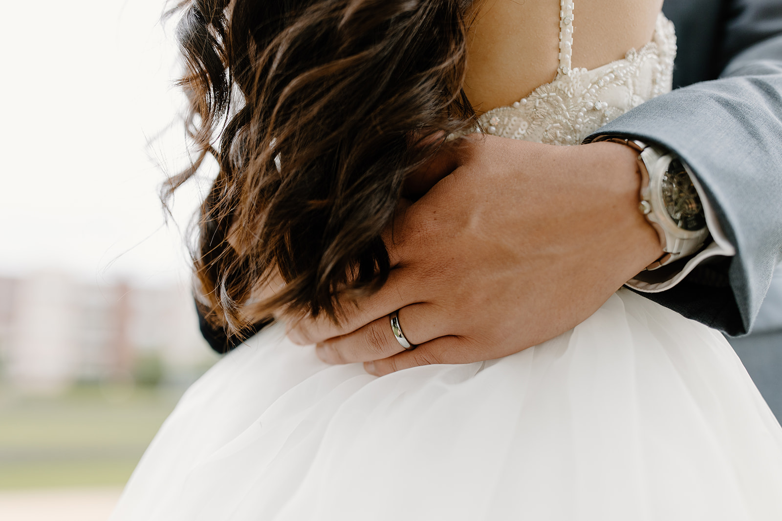Hands on the waist of a bride