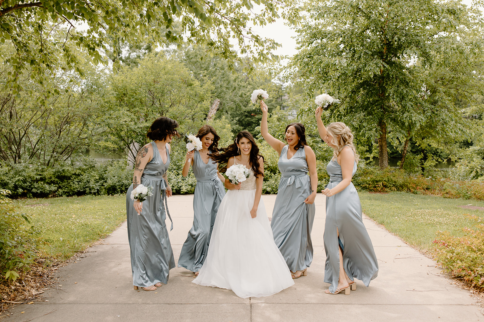 Bride and her bridesmaids pose 