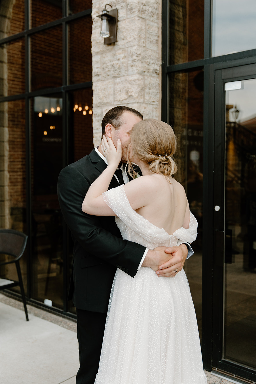 Bride and groom share a kiss