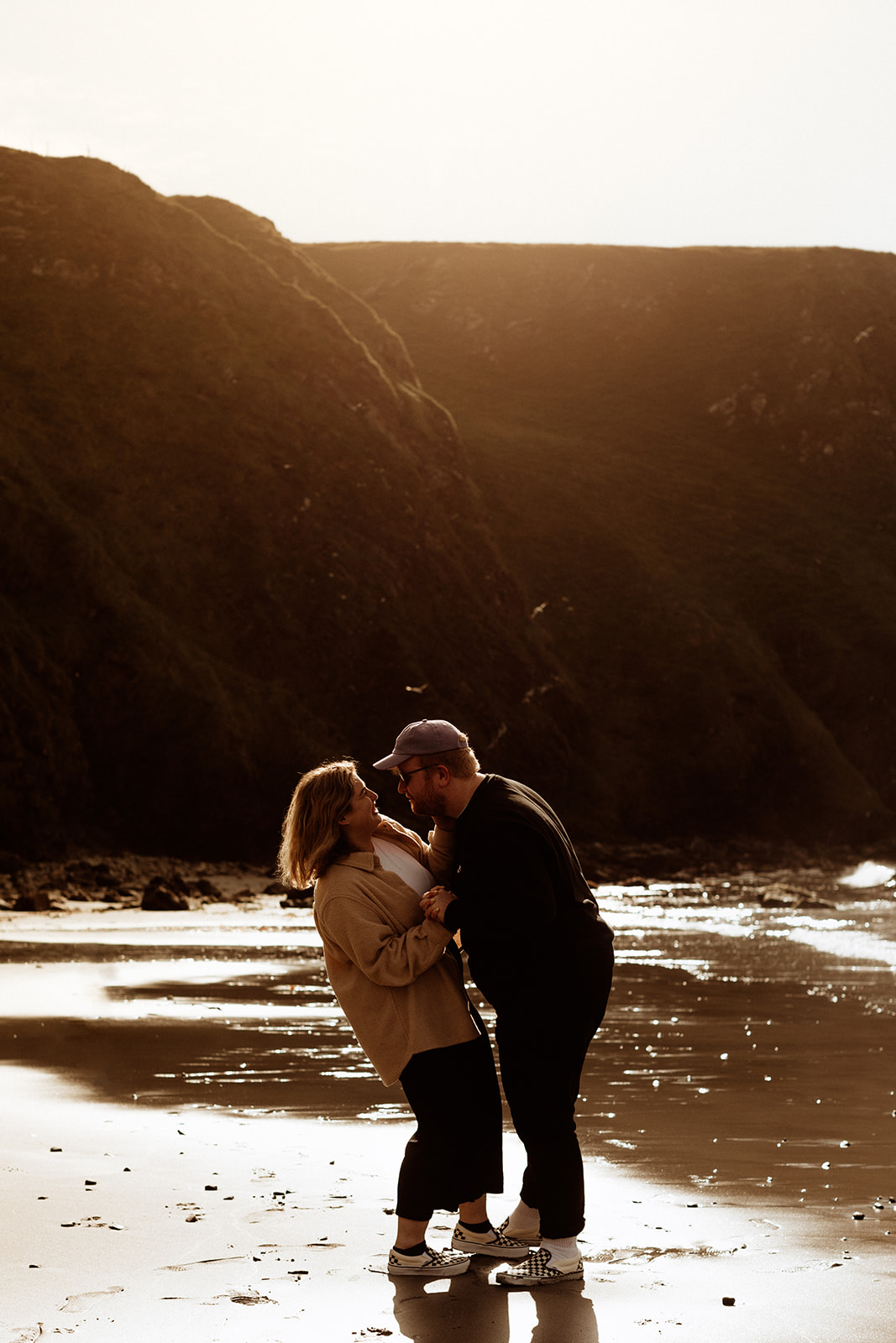 engagement photos in golden hour on a beach 