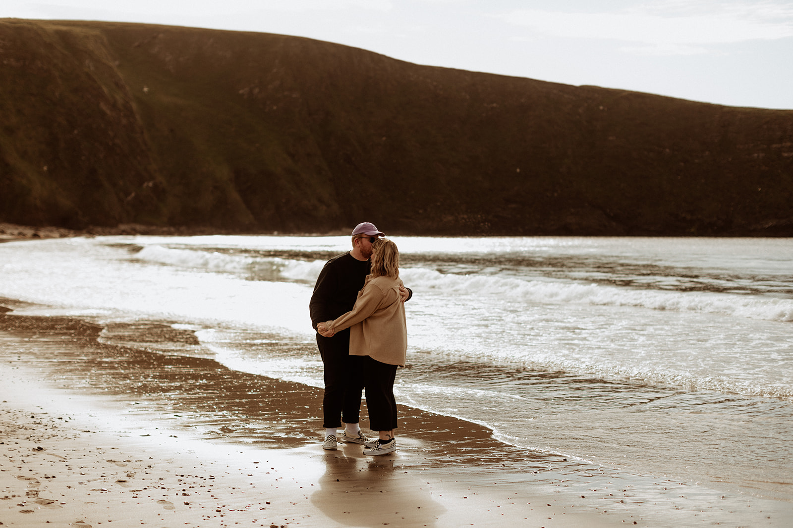 engagement photos in golden hour on a beach 