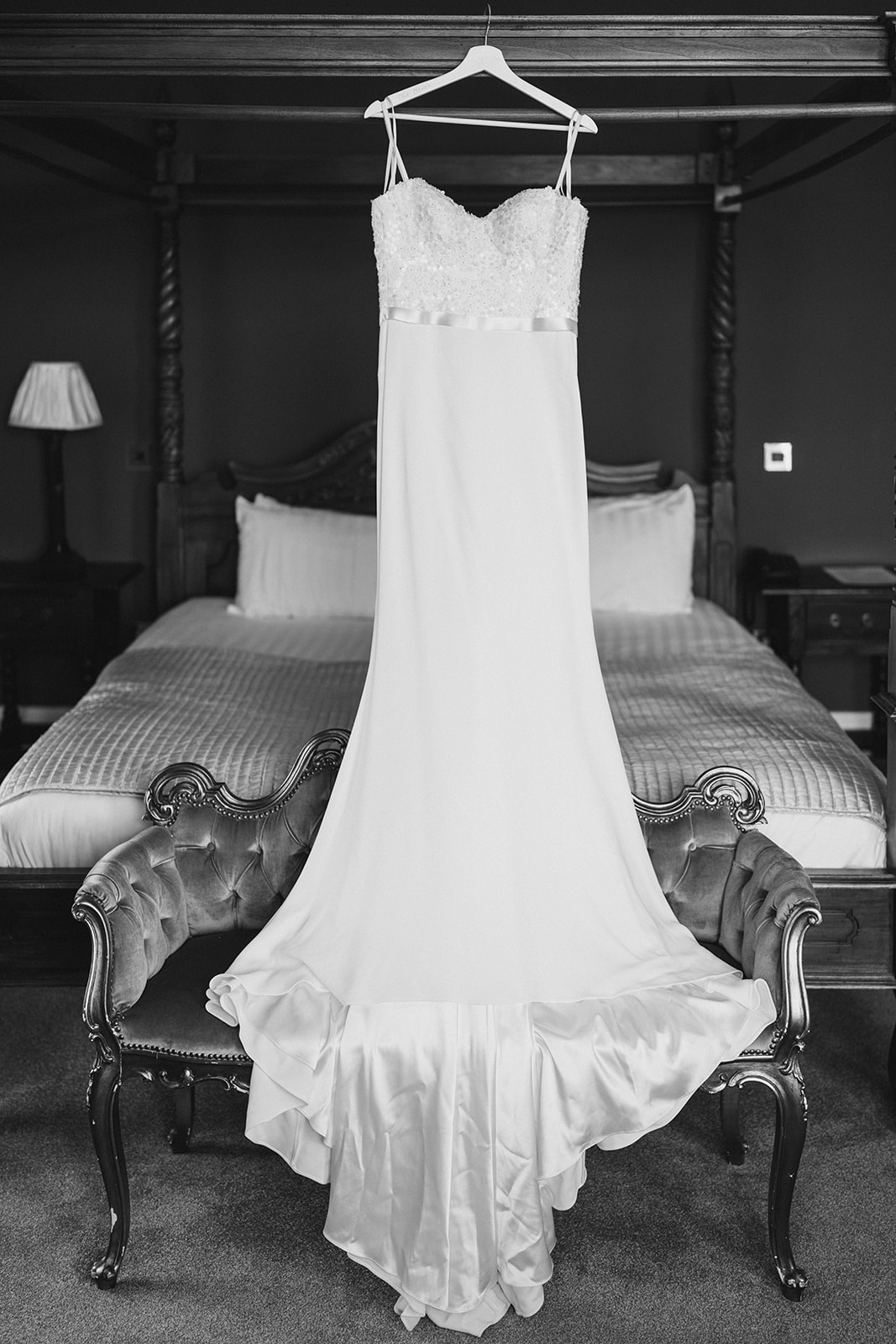Shottle Hall Wedding Photography - the wedding dress hung up at shottle hall
