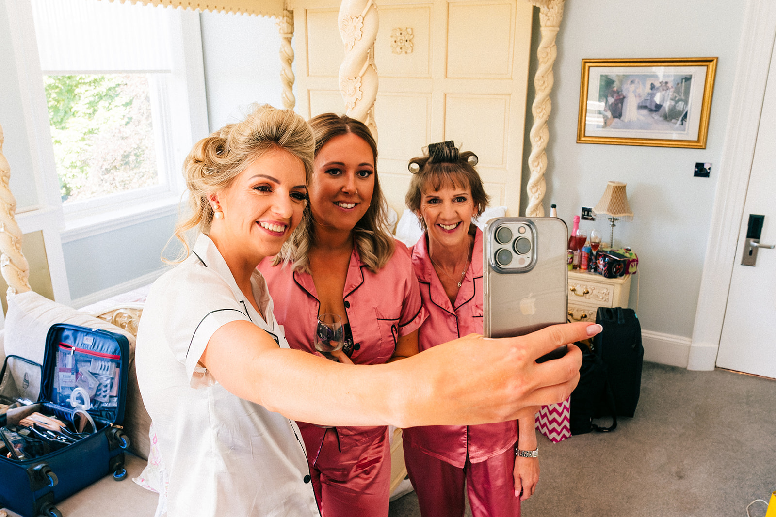 Shottle Hall Wedding Photography - the bride taking a selfie with her bridesmaid and her mum