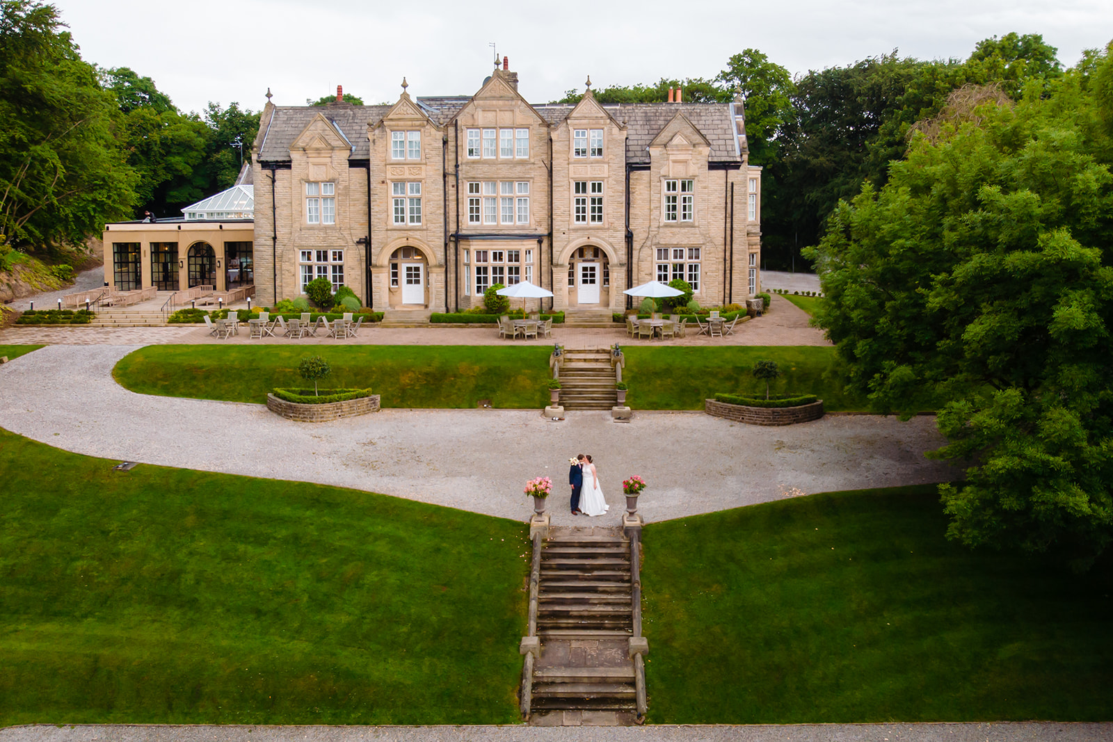 bride and groom kiss photo taken from a drone at Woodlands Hotel