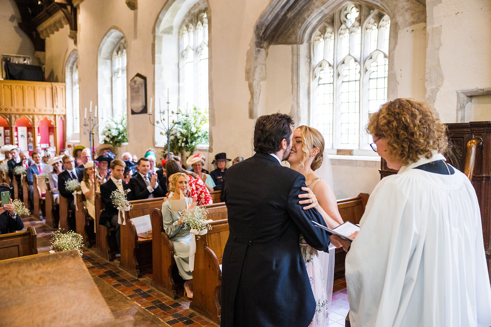 Couple getting married at the Church of St Andrew and St Mary in Grantchester