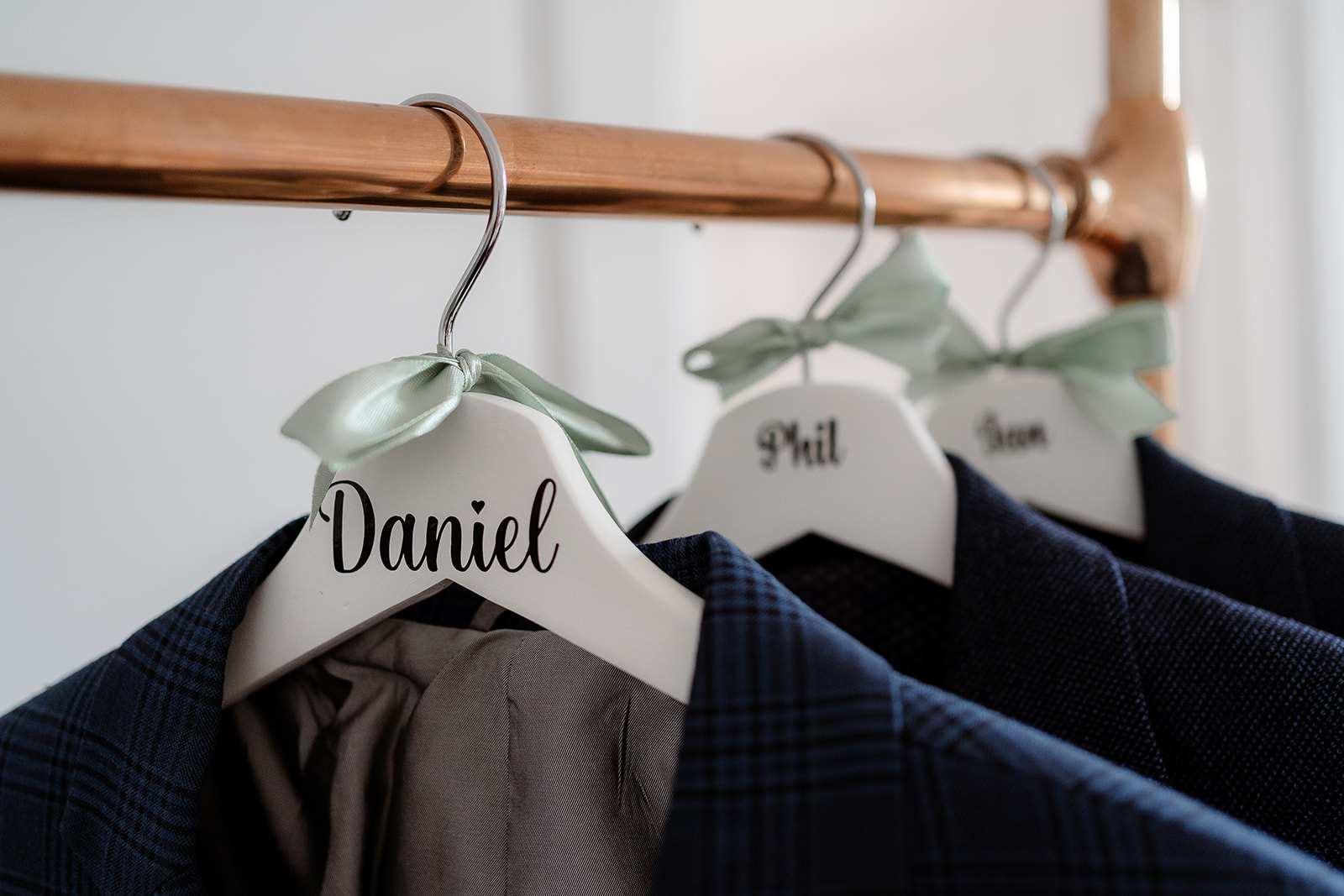 Groom's suit on a hanger for a Syrencot wedding. 