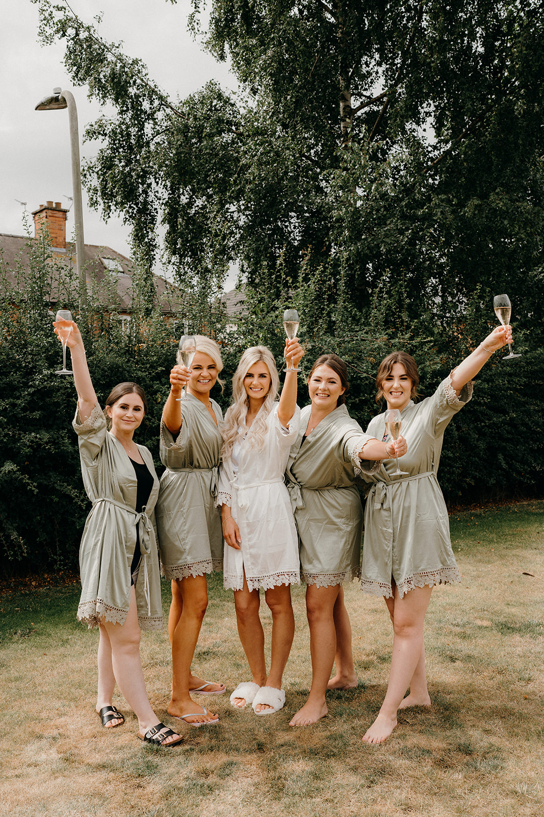 Girls cheering with champagne and celebrating the brides marriage