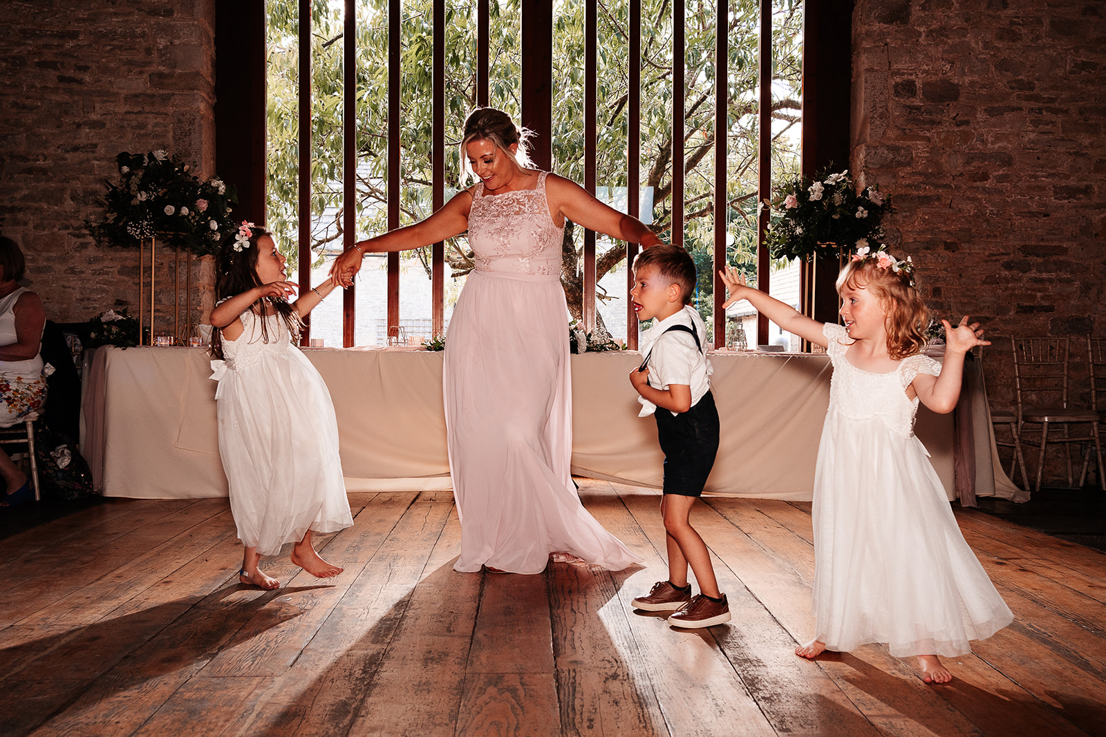 Wedding guests dancing in the rustic barn at Kingston Country Courtyard
