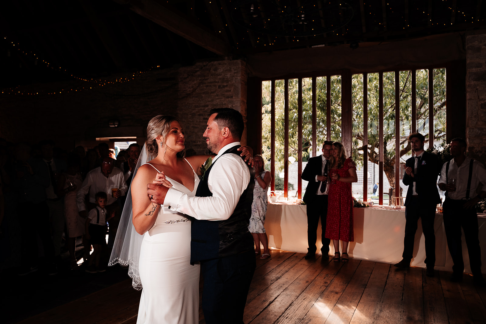 Newlywed couple's first dance in the rustic barn at a Kingston Country Courtyard  wedding