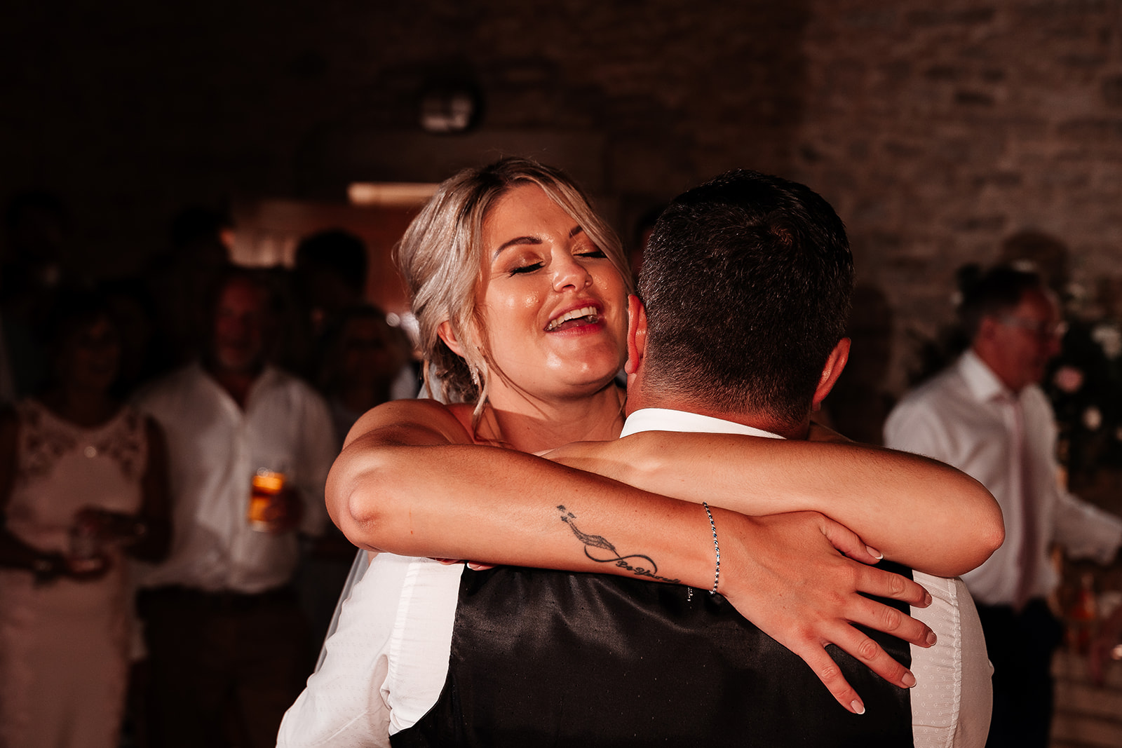 Newlywed couple's first dance in the rustic barn at a Kingston Country Courtyard  wedding