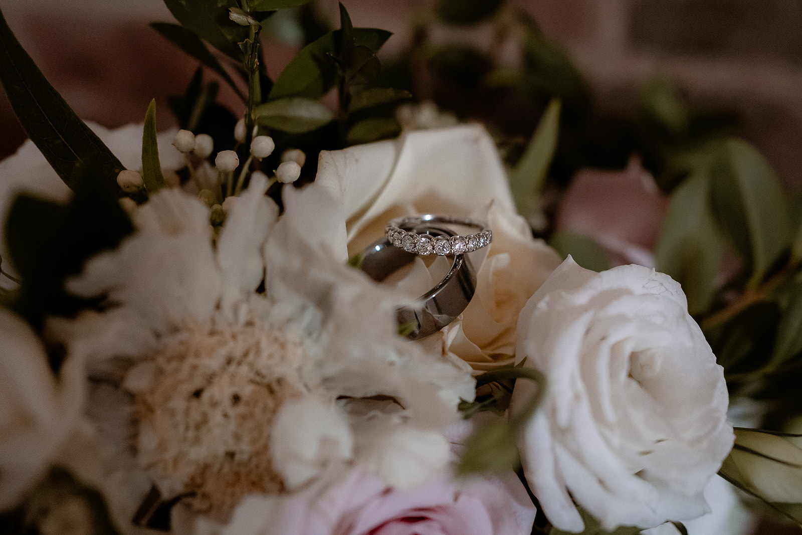 wedding rings and flowers at a Kingston Country Courtyard Wedding