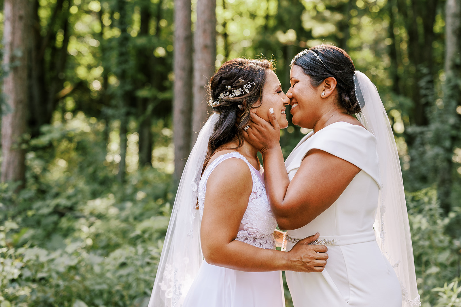 couple kisses in the woods on their wedding day in central wisconsin