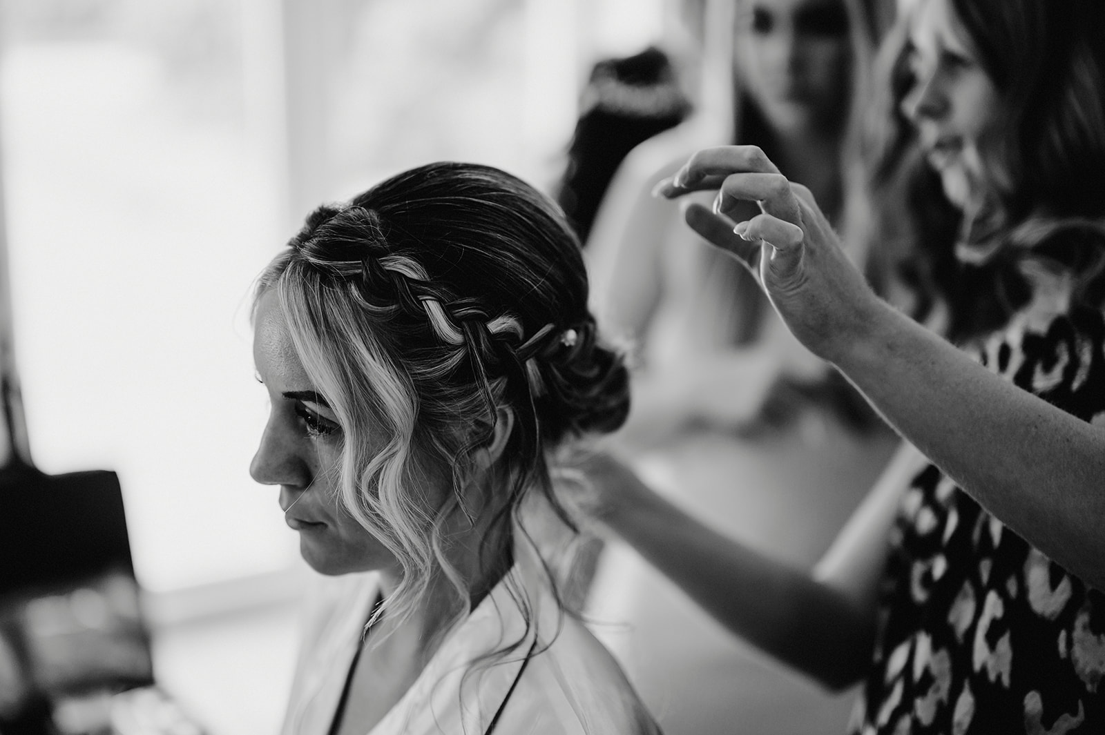black and white photo of a bride having her hair done at villiers barn