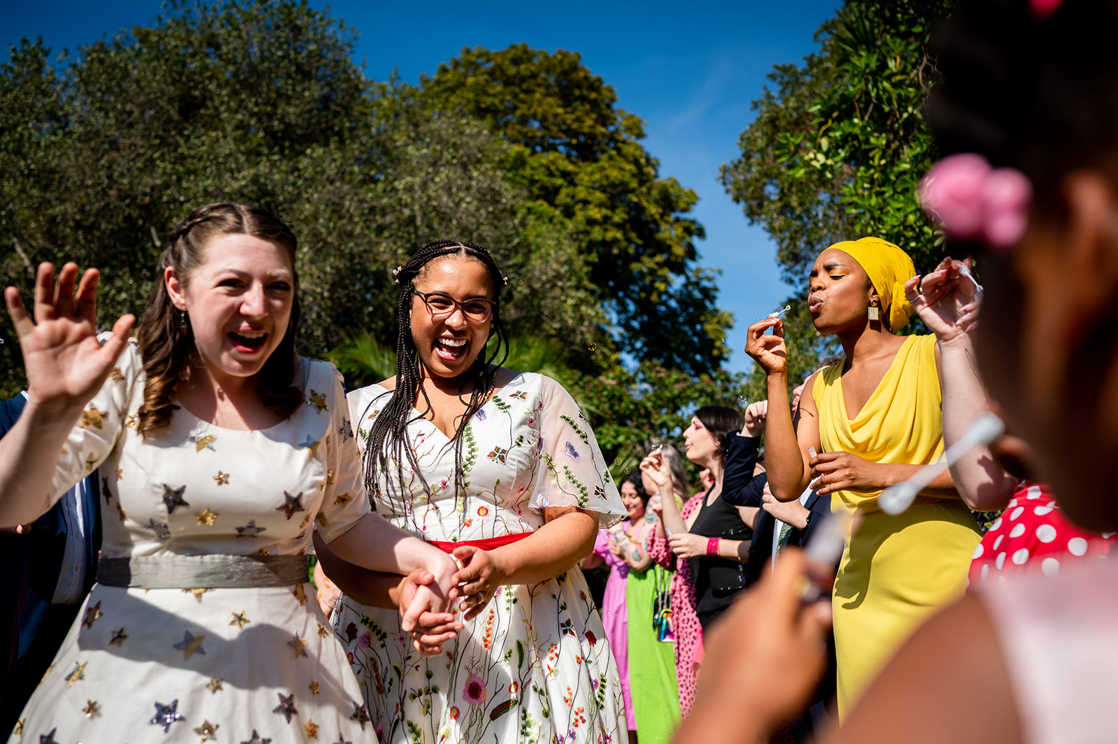 bubble confetti and two brides at Kew Gardens wedding