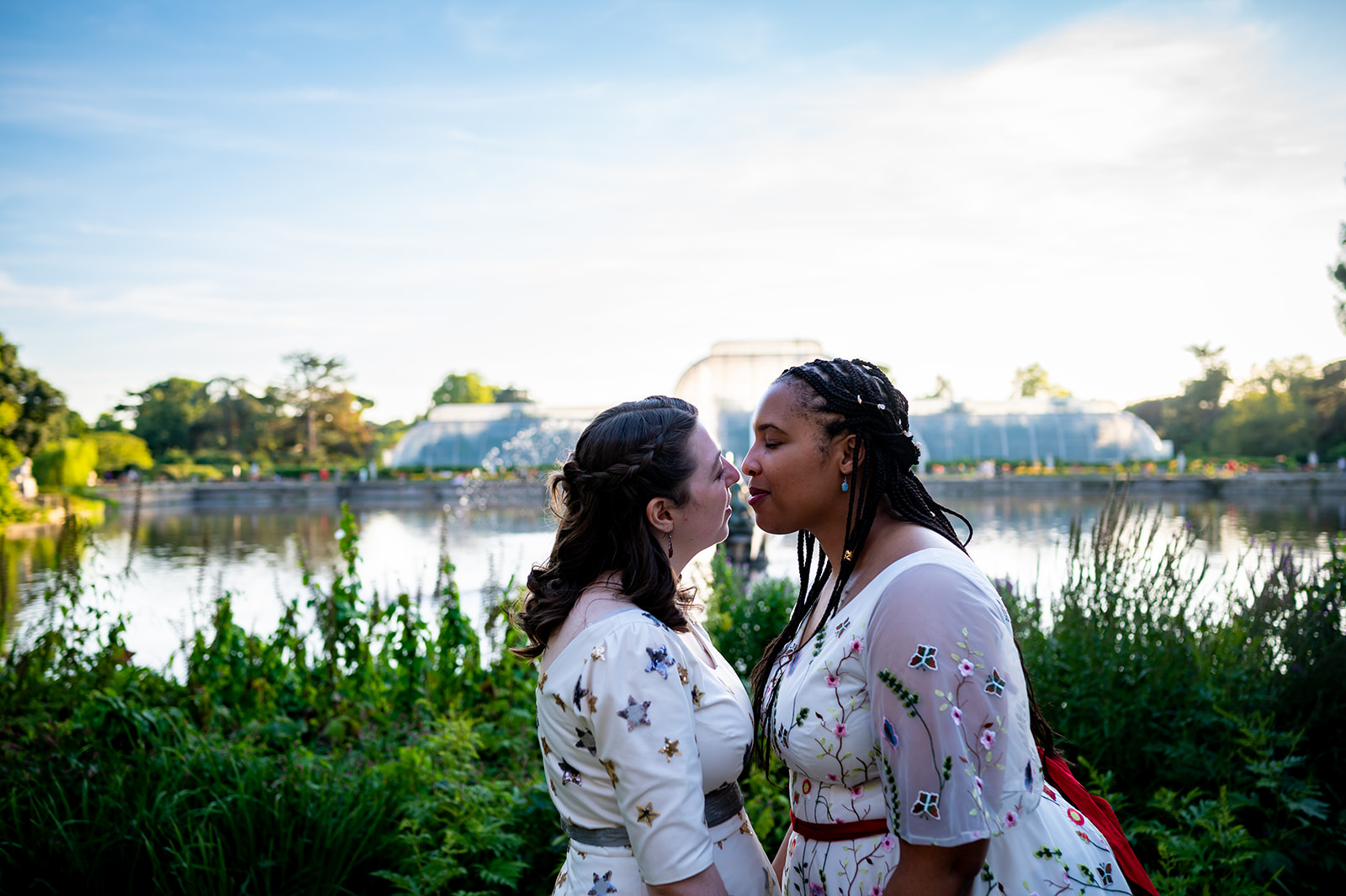 golden hour photos in front of a fountain for two lovely brides on their wedding day at Kew Gardens