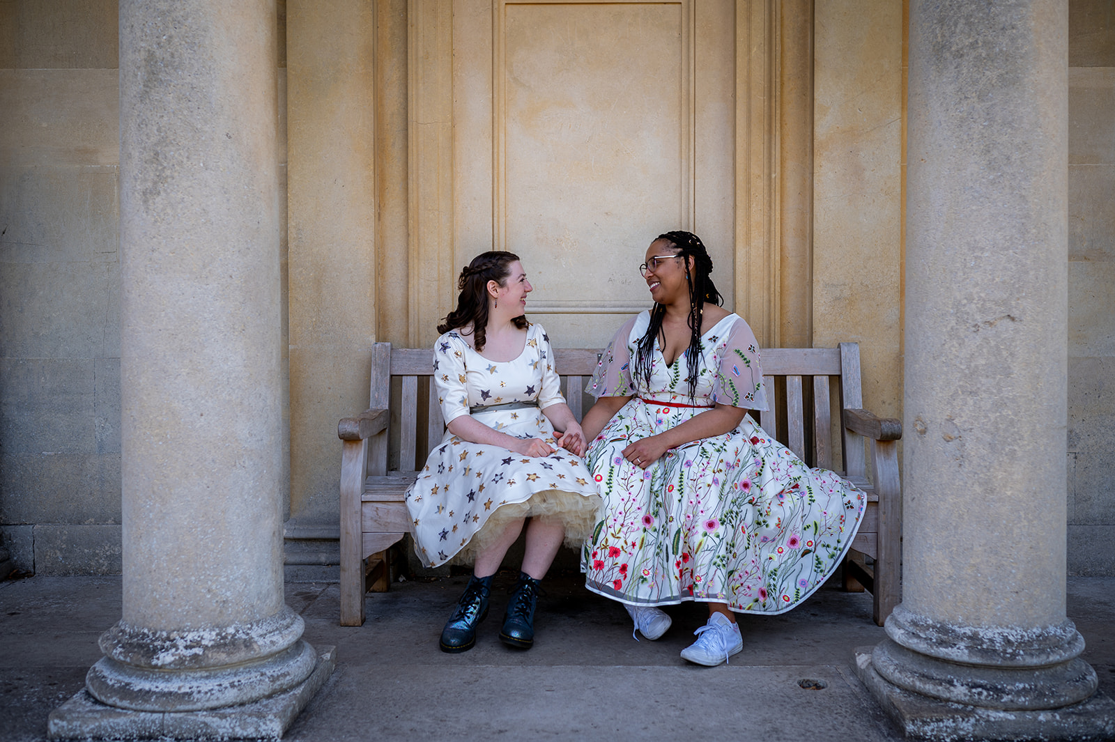 two brides seated at kew gardens LGBTQ + wedding