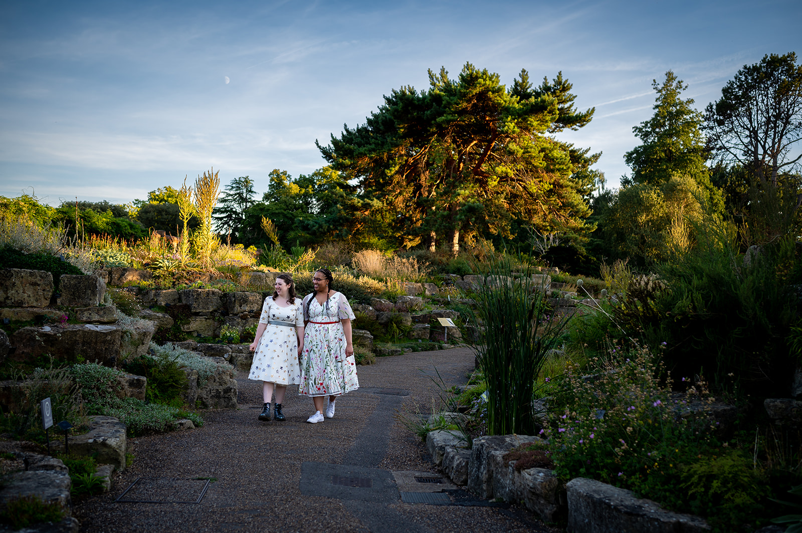 two brides walking through Kew Gardens