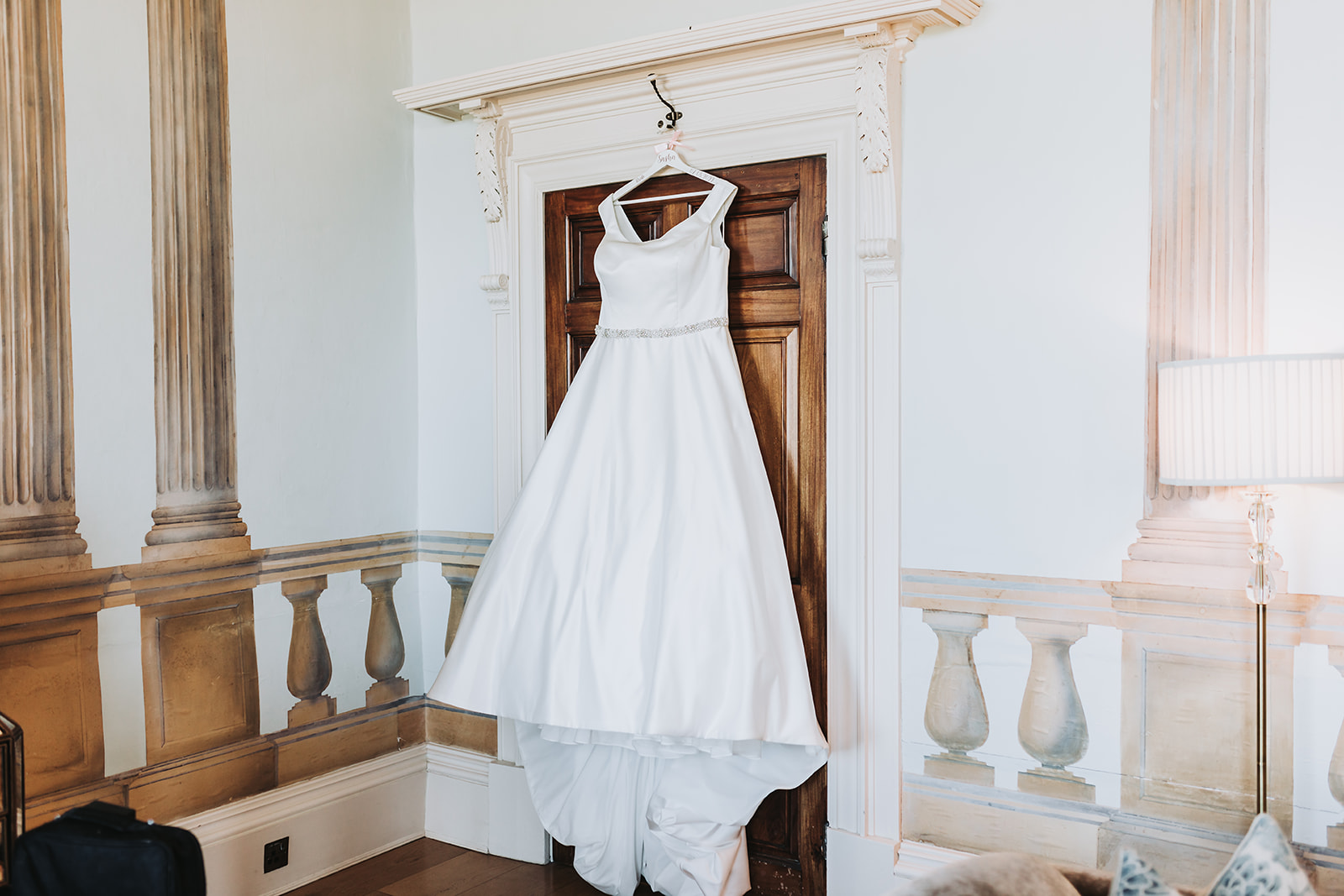 wedding dress hung up at rockbeare manor
