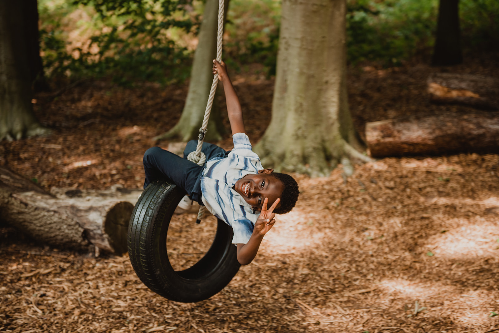 A child swings on a tire during a wedding at Happy Valley Norfolk