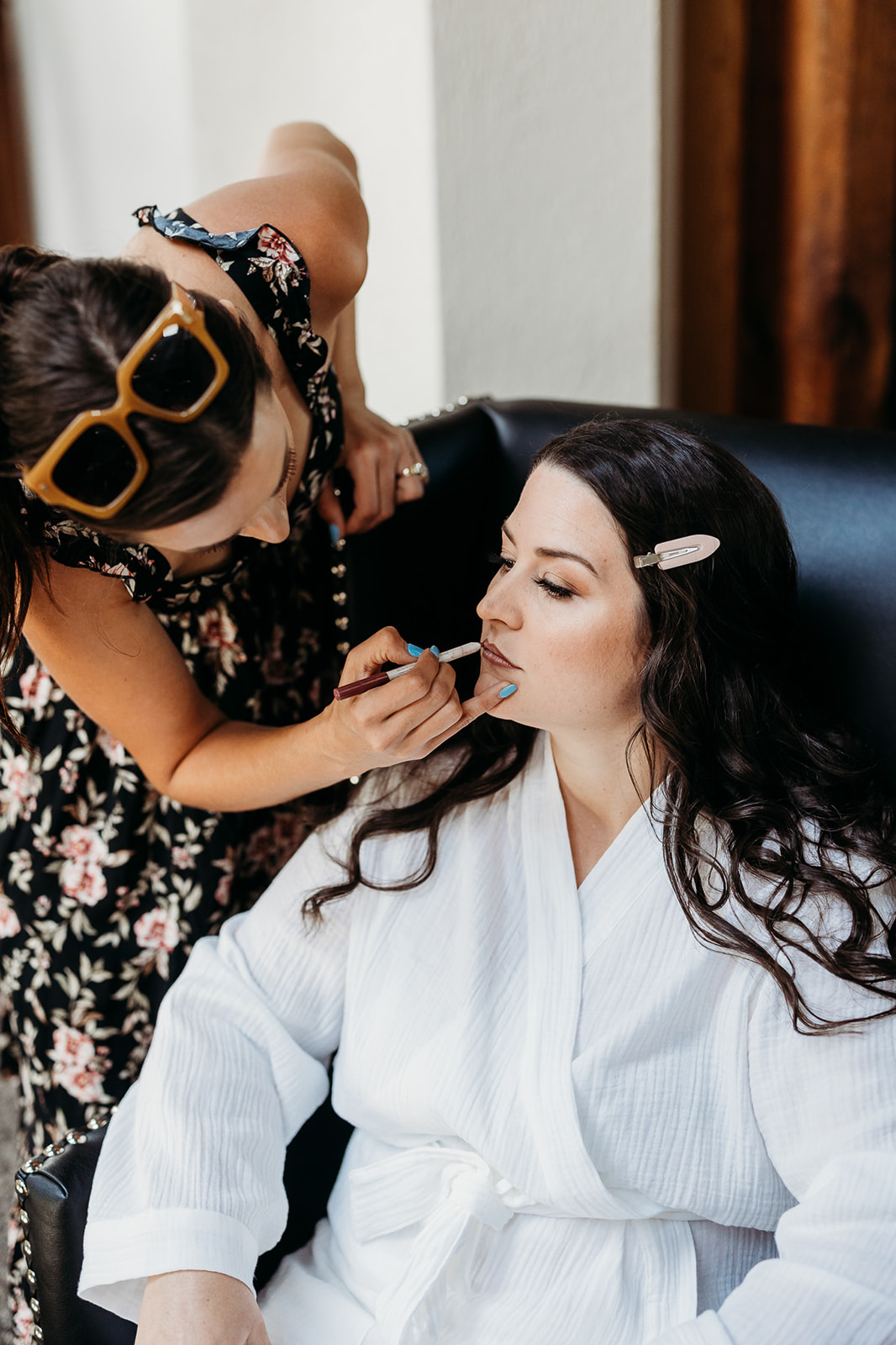 Bride getting her makeup done at the refinery 