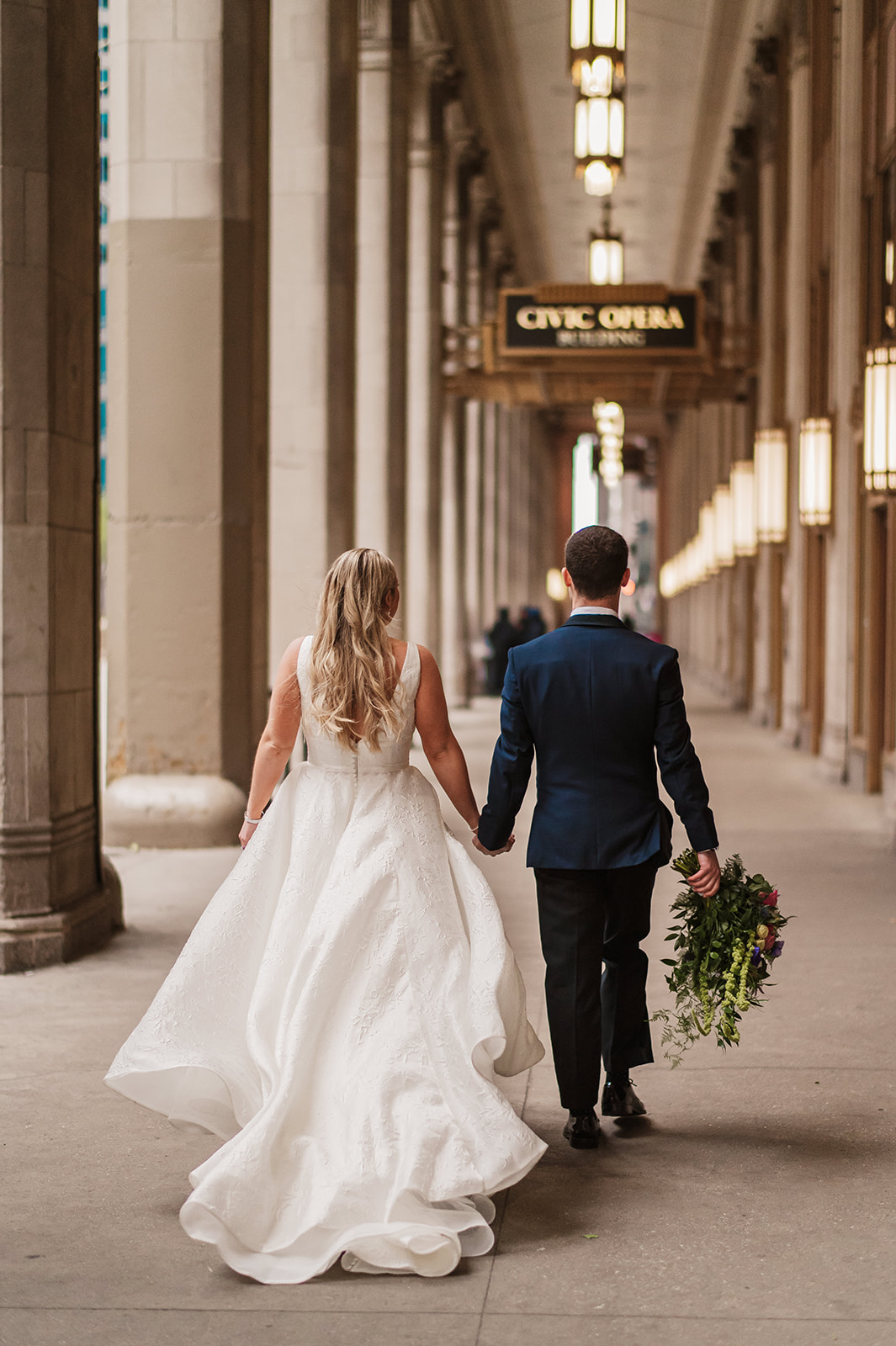 epic bride and groom wedding photos at the Lyric Opera Chicago.