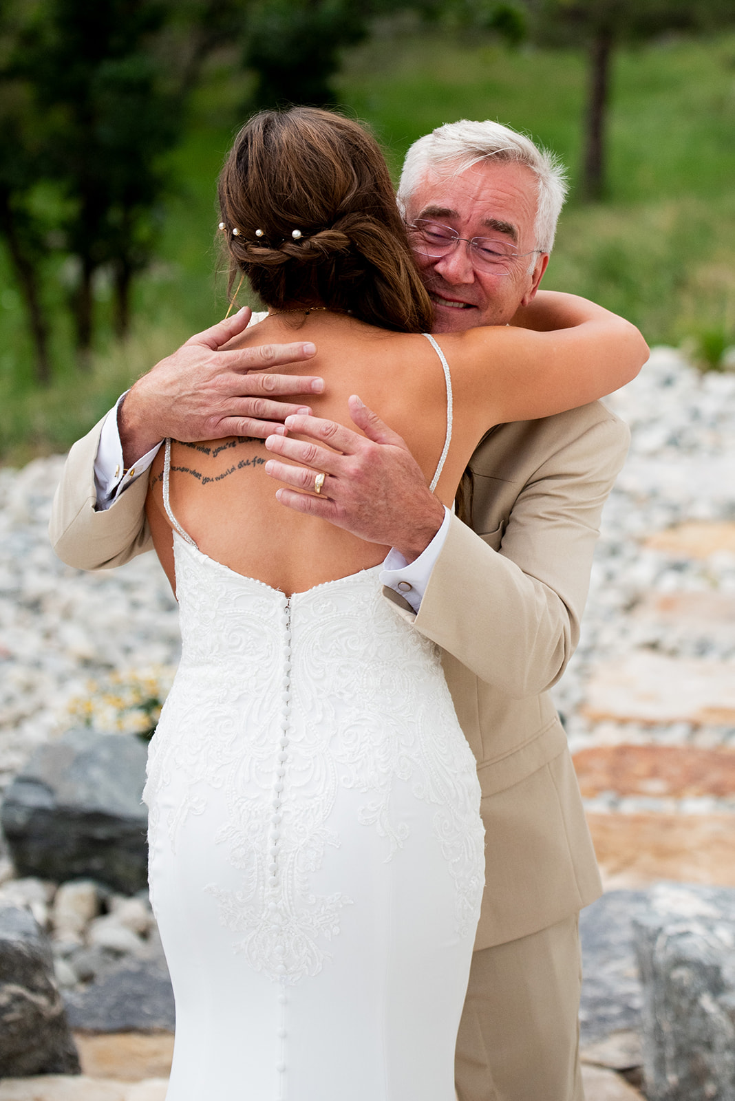 Bride and her father share a hug before the ceremony.
