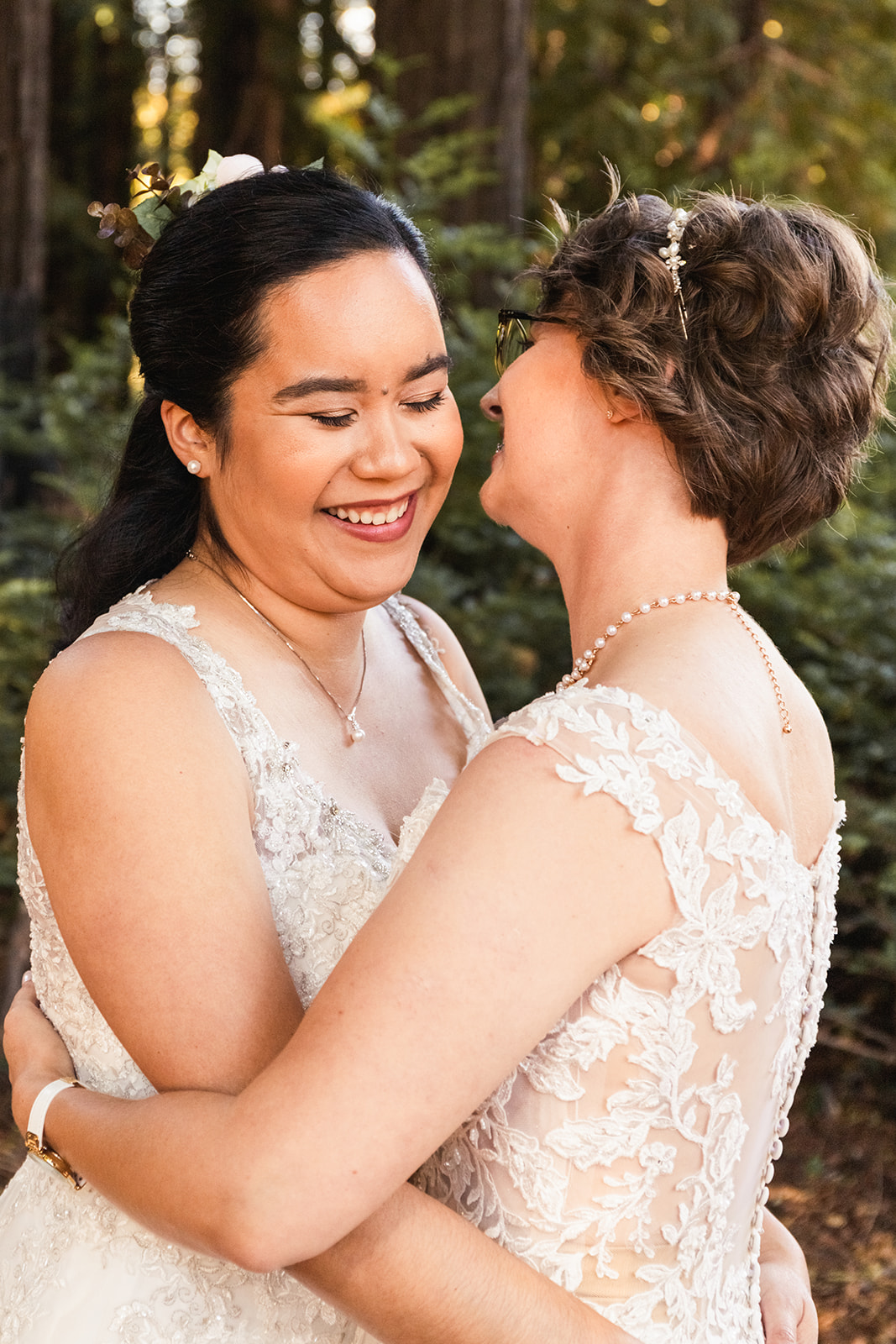 Two brides embrace in Woodside, California