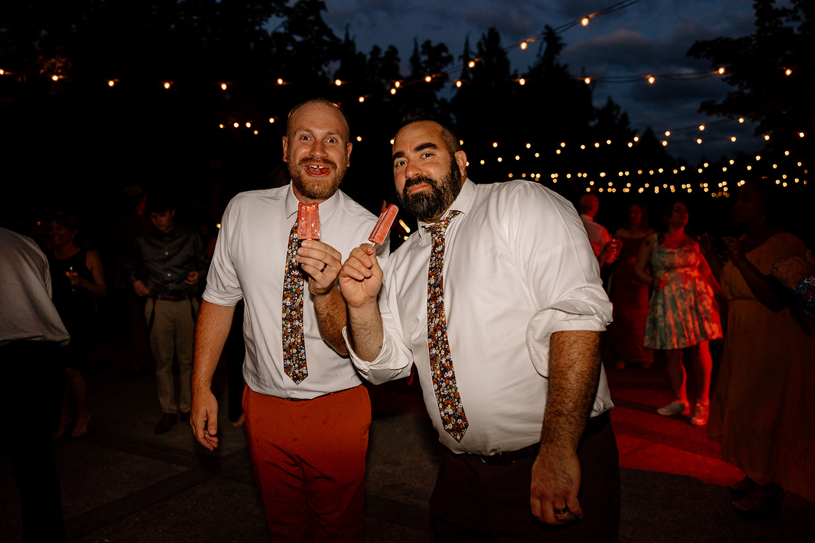 Two grooms enjoying Sloshy Pops at their Oregon Garden wedding reception. 
