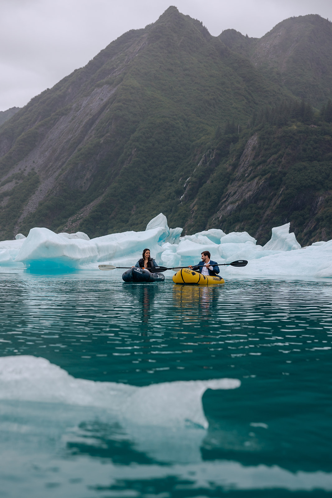 bride and groom with icebergs in alaska